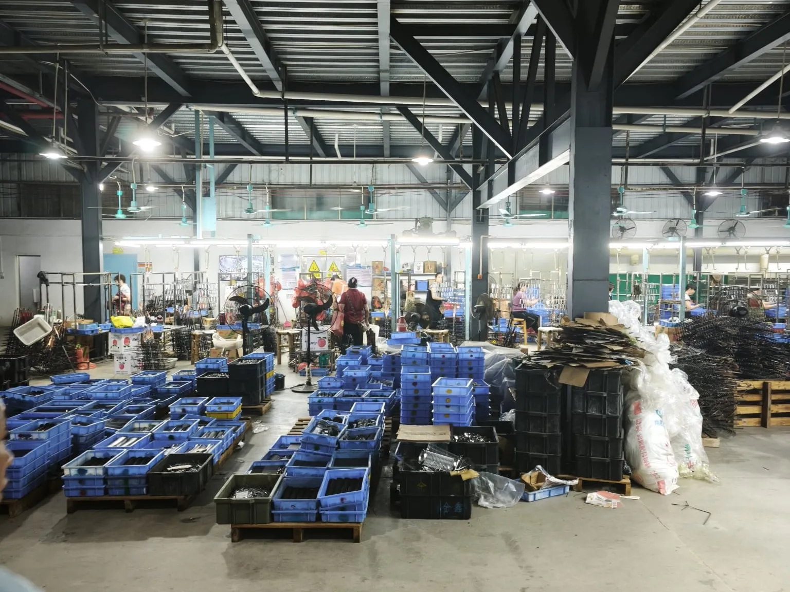 Crates of parts sorted by order in the staging area