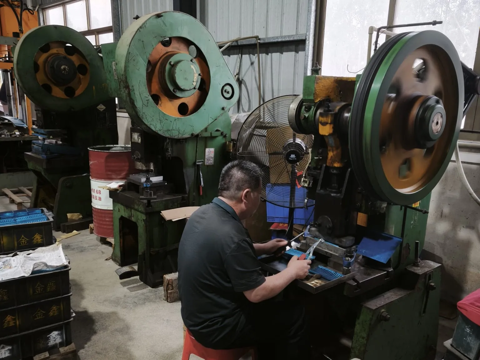 Operator feeding parts into a mechanical press