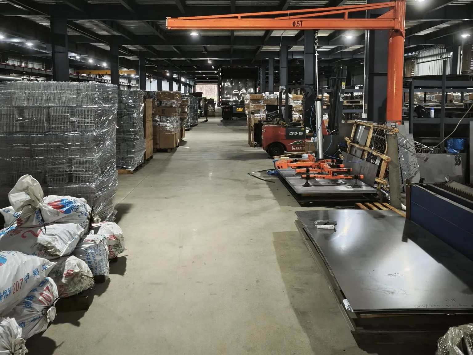 Jib crane and steel sheet stock in the materials aisle