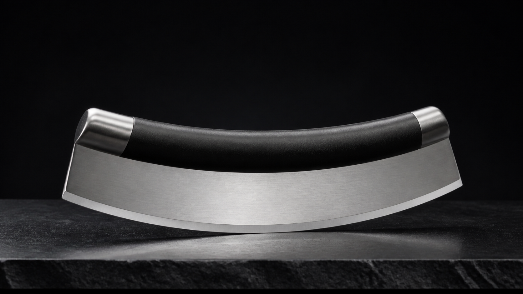Pizza Rocker Knife product photograph on a dark studio background
