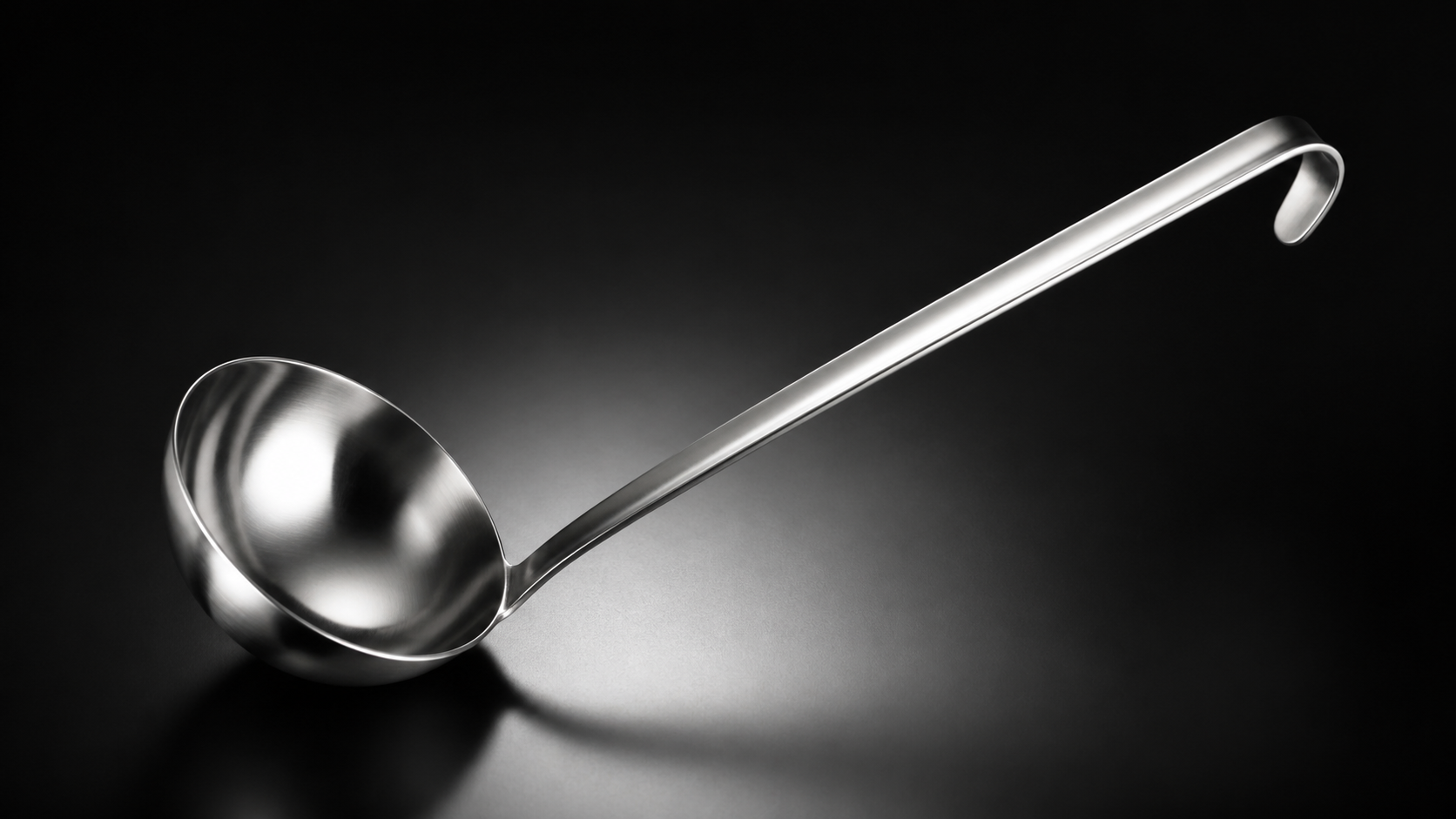 Soup Ladle product photograph on a dark studio background