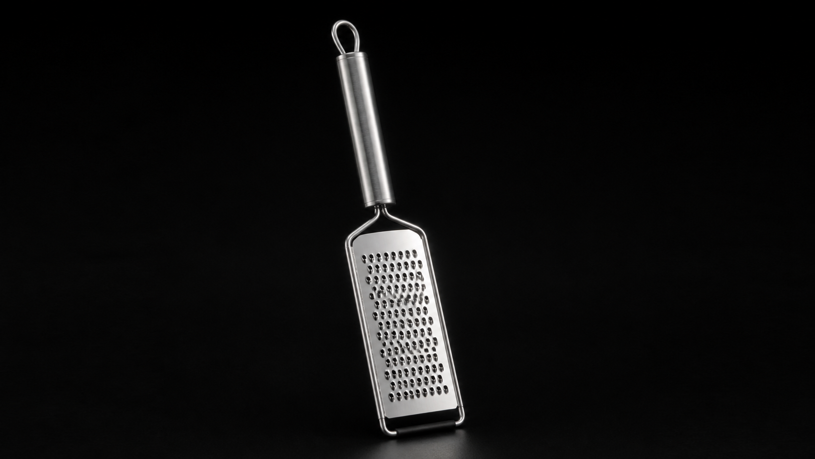 Stainless Steel Cheese Grater product photograph on a dark studio background