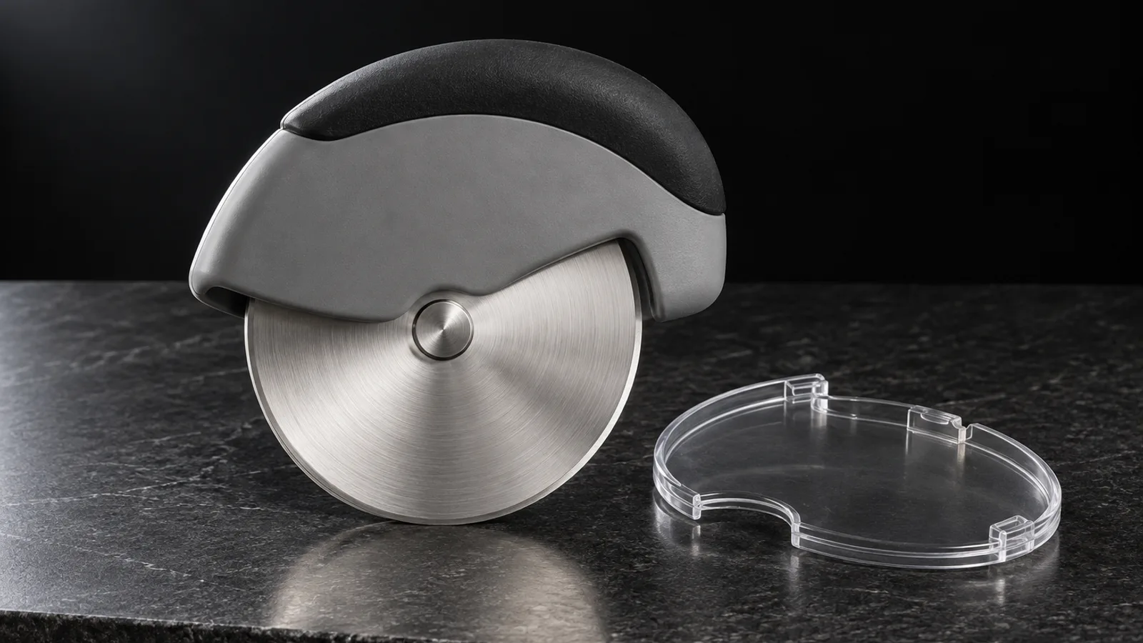 Palm-grip pizza wheel with a stainless steel blade beneath a rounded grip